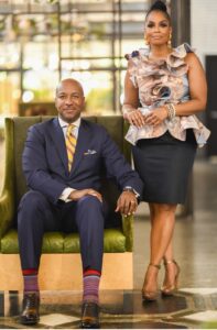 Man and woman posing in stylish outfits