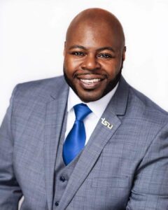 Smiling man wearing a suit and tie