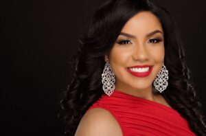 Woman in red dress smiling elegantly