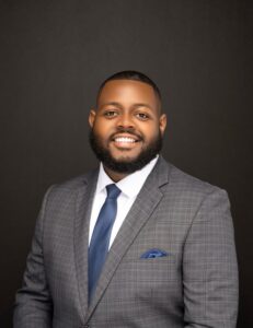 Smiling man with a blue tie