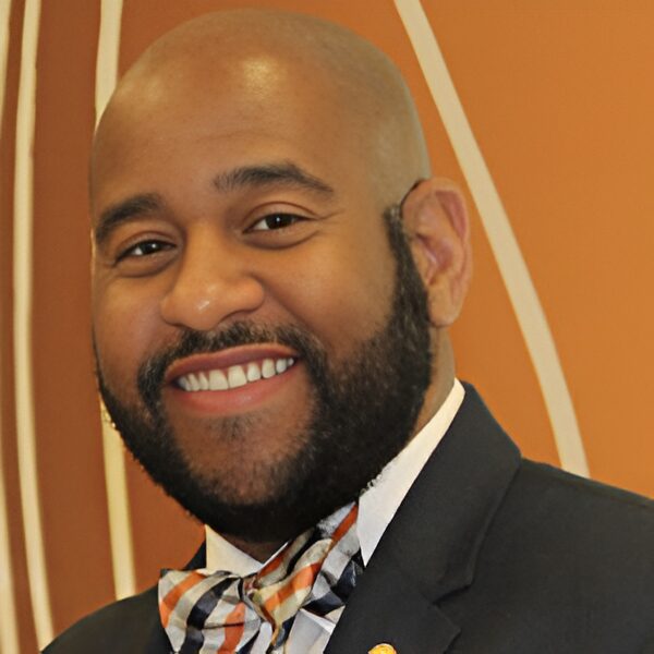 Happy man against orange background