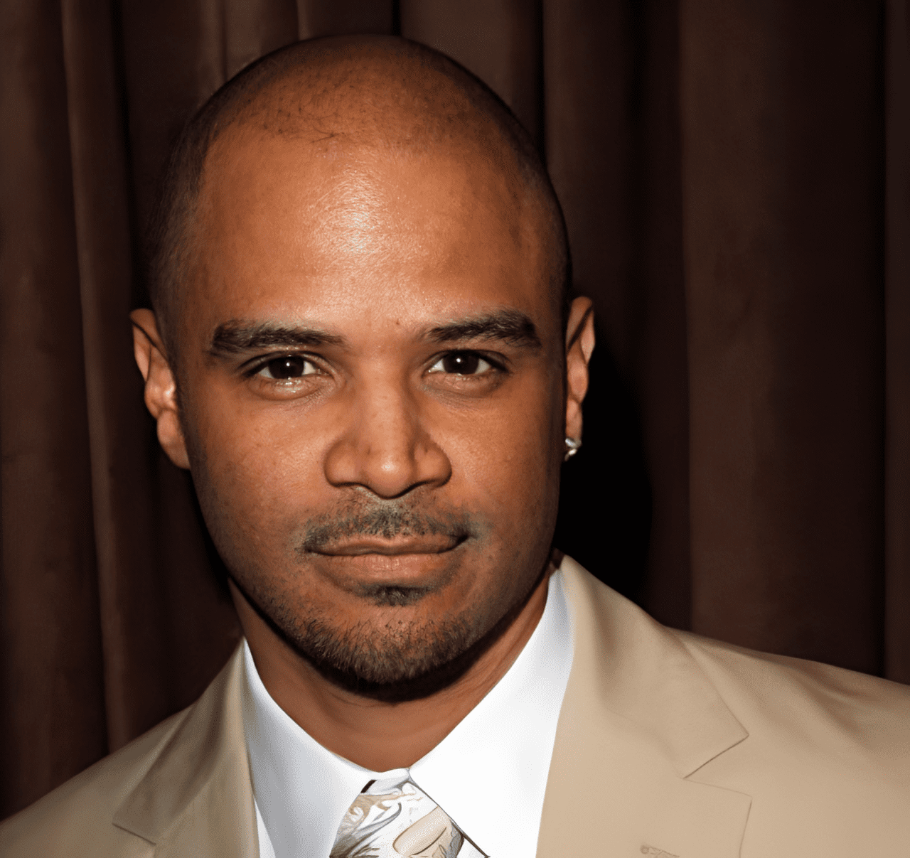 Man with goatee in formal attire