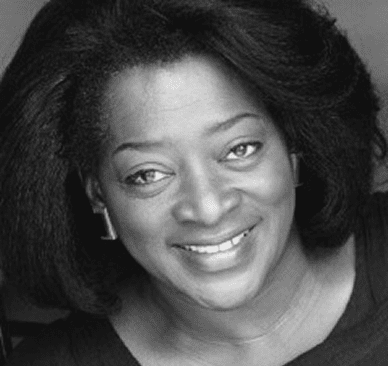 Black and white photo of a smiling woman