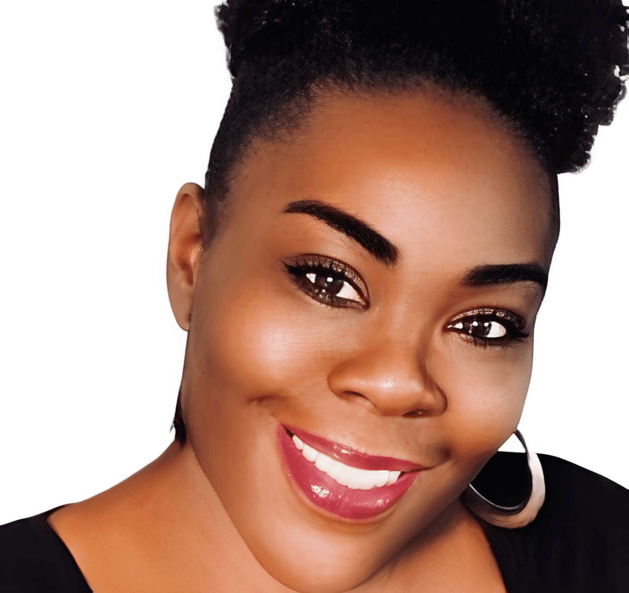 Woman with natural hairstyle smiling brightly