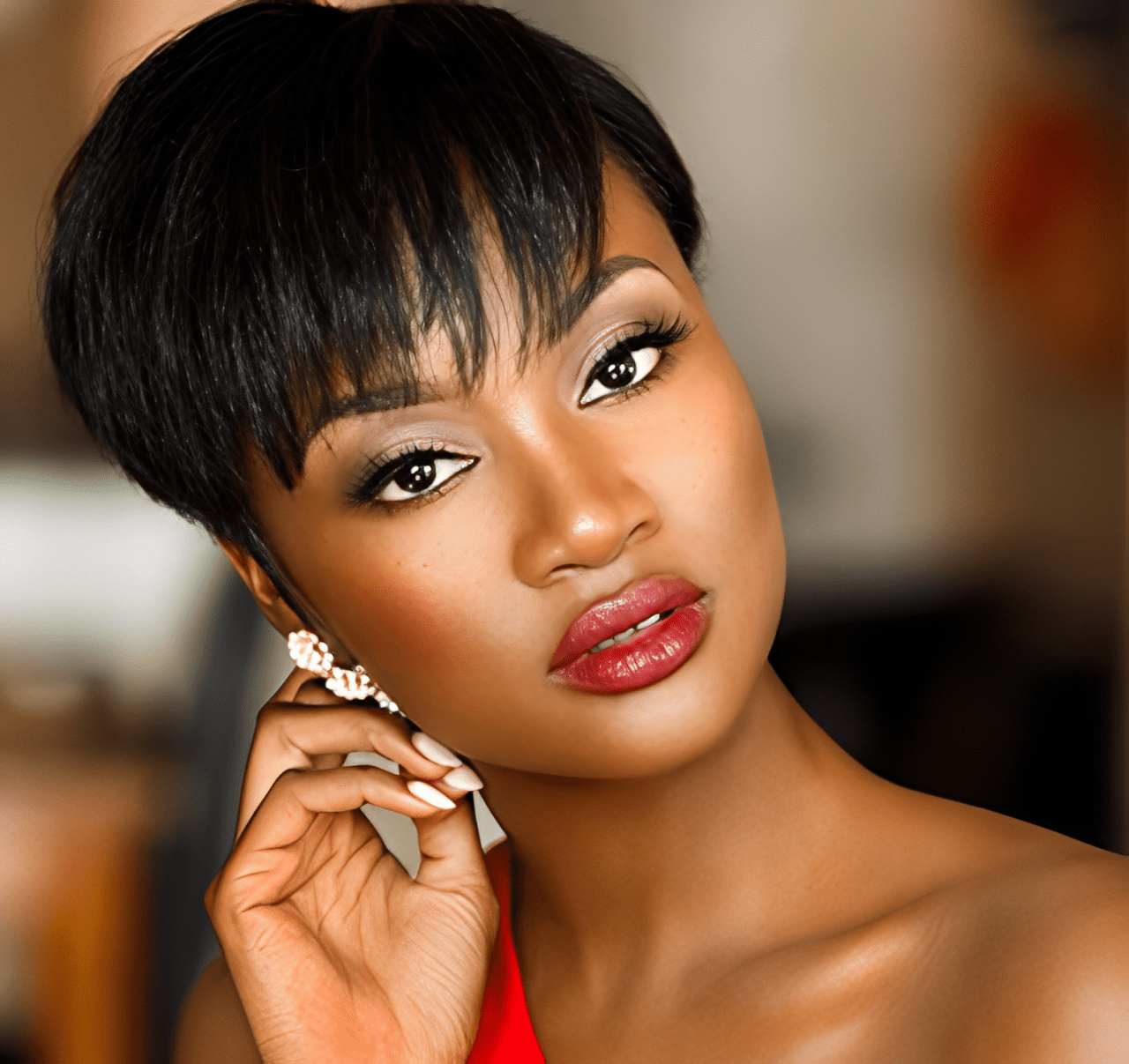 Elegant woman posing with hand by face